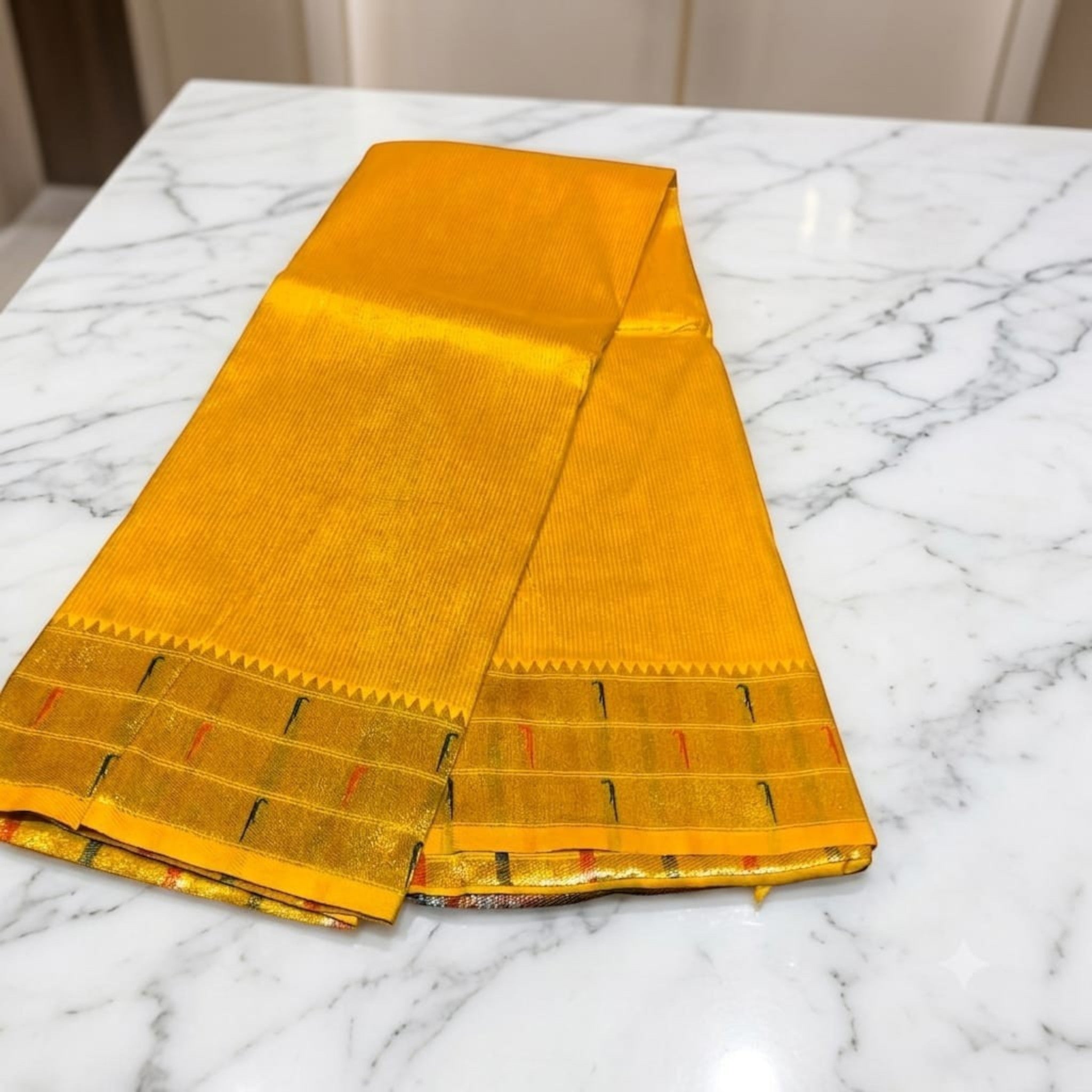 City Center yellow silk Muniya Paithani saree with traditional gold zari border and intricate parrot motifs