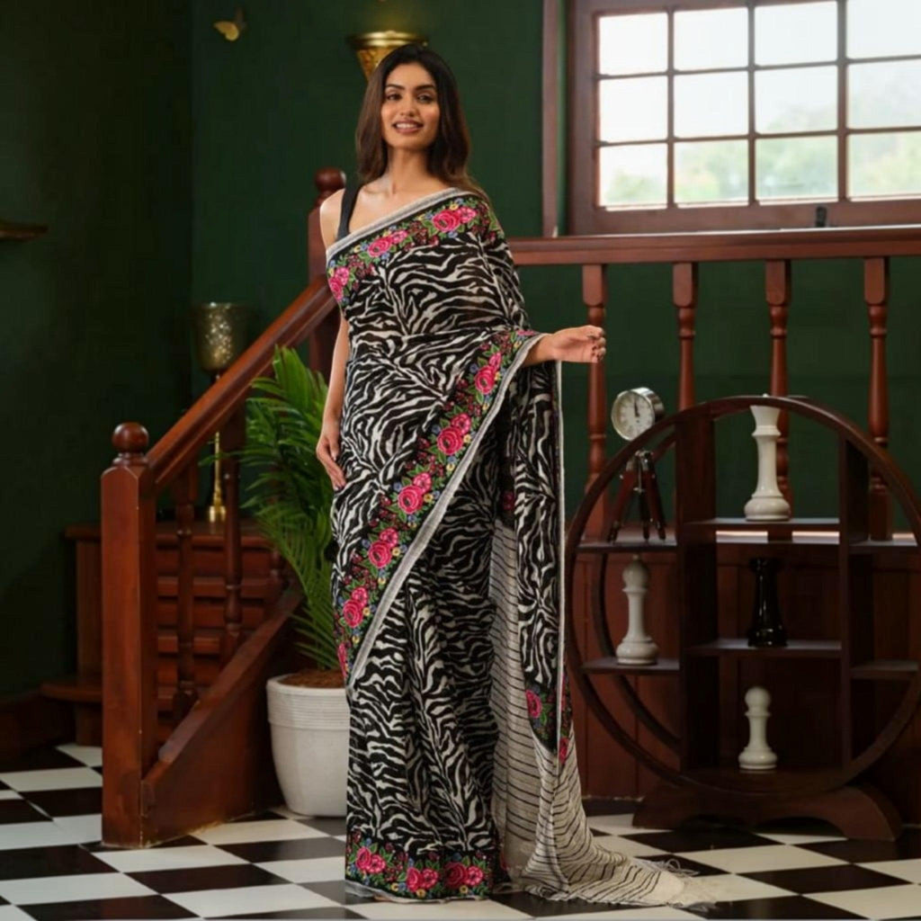 City Center premium cotton saree featuring a black and white zebra print with vibrant pink floral embroidered borders.