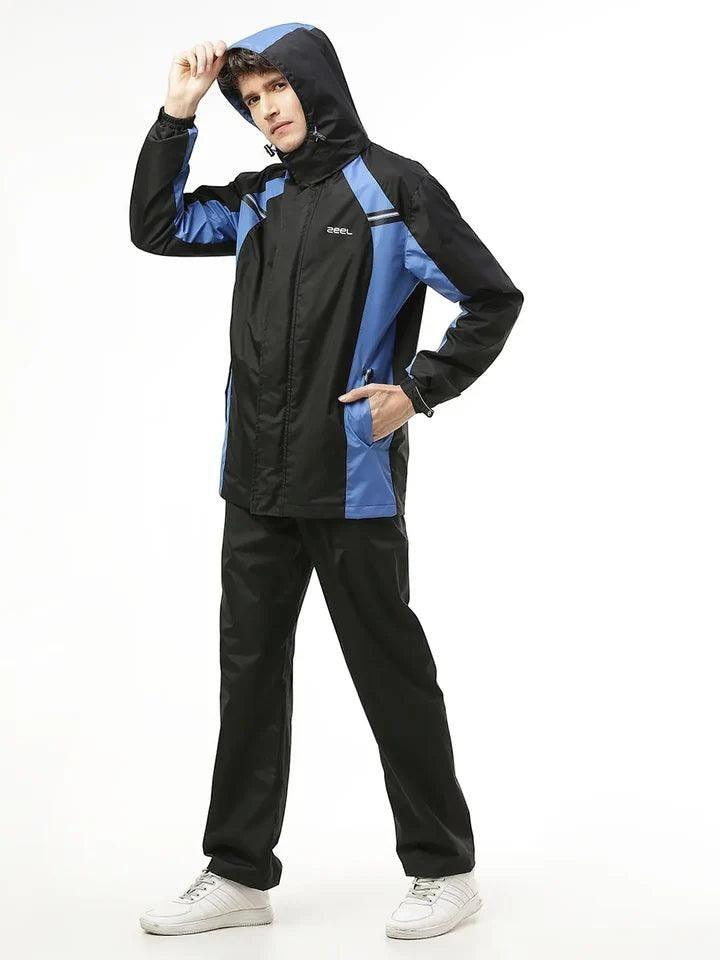 City Center Zeel Go Hike black and blue waterproof rainsuit with hood worn by a male model against a white background