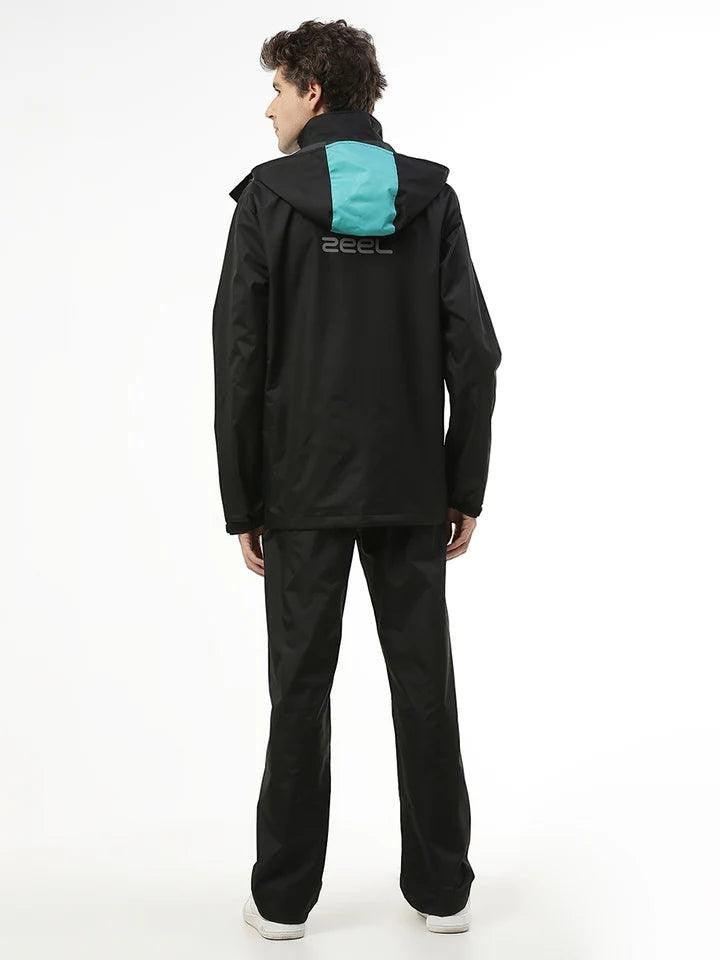 City Center Zeel Go Hike black and blue waterproof rainsuit with helmet-compatible hood worn by a man from the back