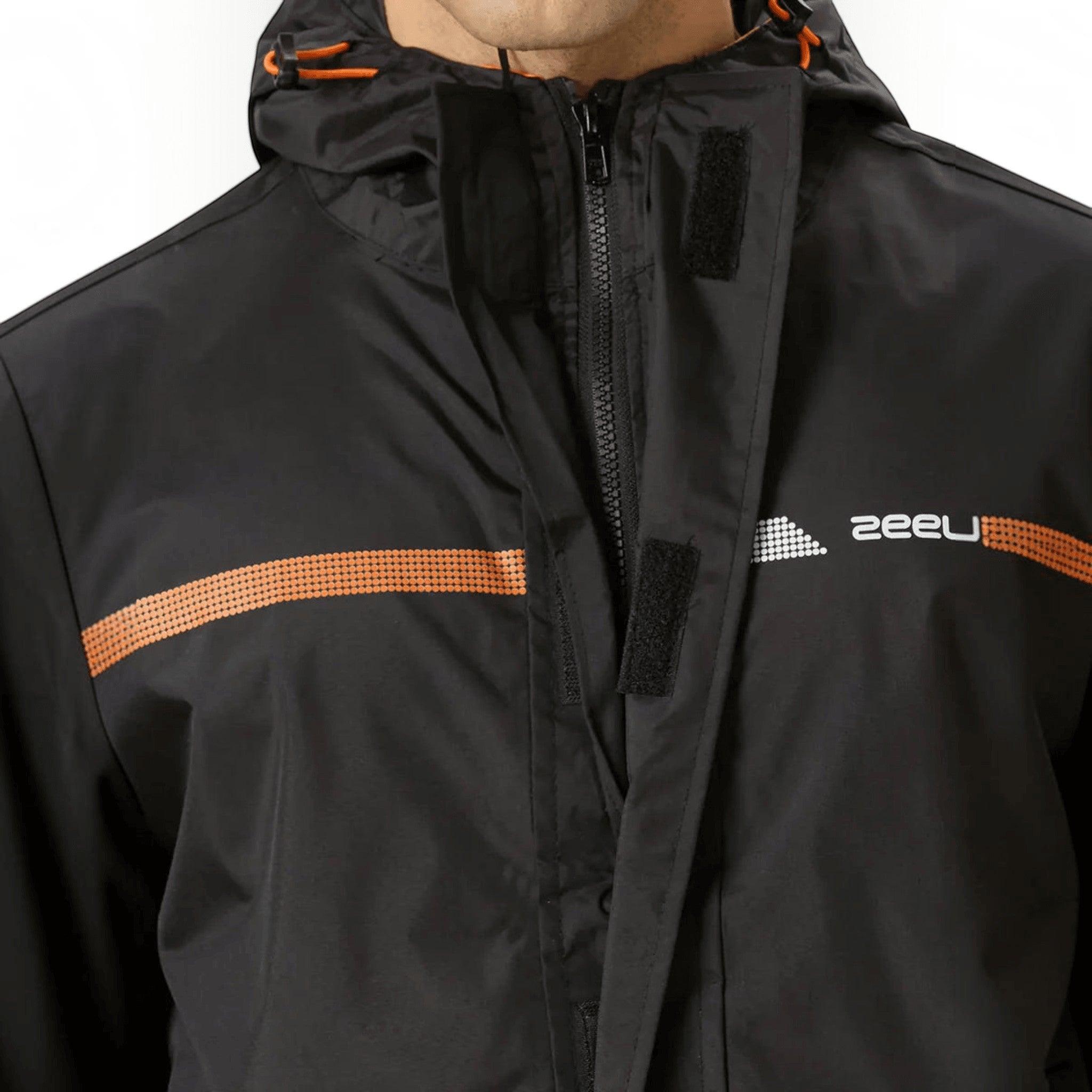 City Center ZEEL premium black waterproof rain jacket with orange accents, high-neck collar, and storm flap closure.