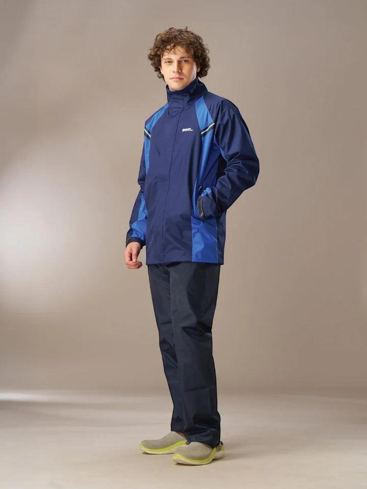 City Center Zeel Go Hike black and blue waterproof rainsuit worn by a male model for outdoor monsoon protection.
