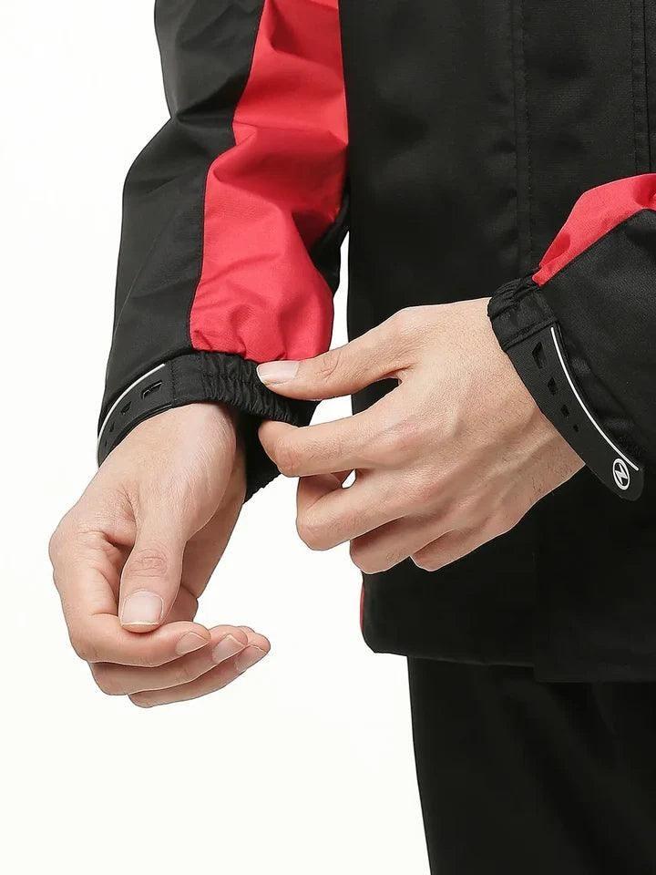City Center Zeel Go Hike rainsuit featuring black and red waterproof fabric with adjustable silicon wrist closures.
