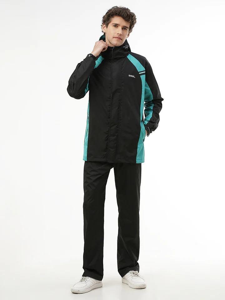 City Center Zeel Go Hike black and blue waterproof rainsuit with hood, worn by a male model against a white background.