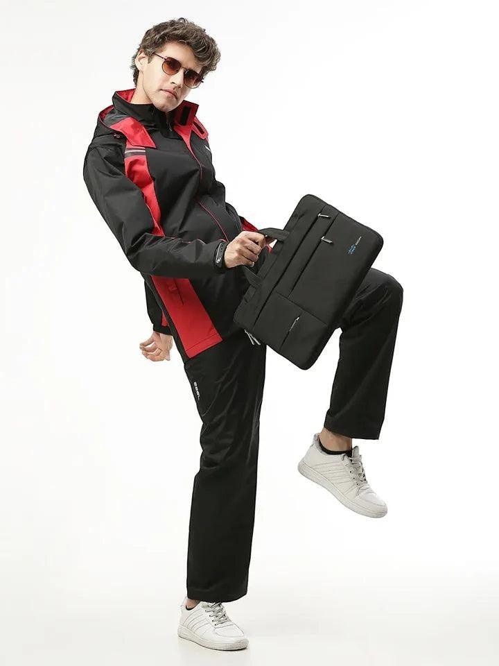 City Center Zeel Go Hike black and red waterproof rainsuit with hood and utility pockets worn by a male model