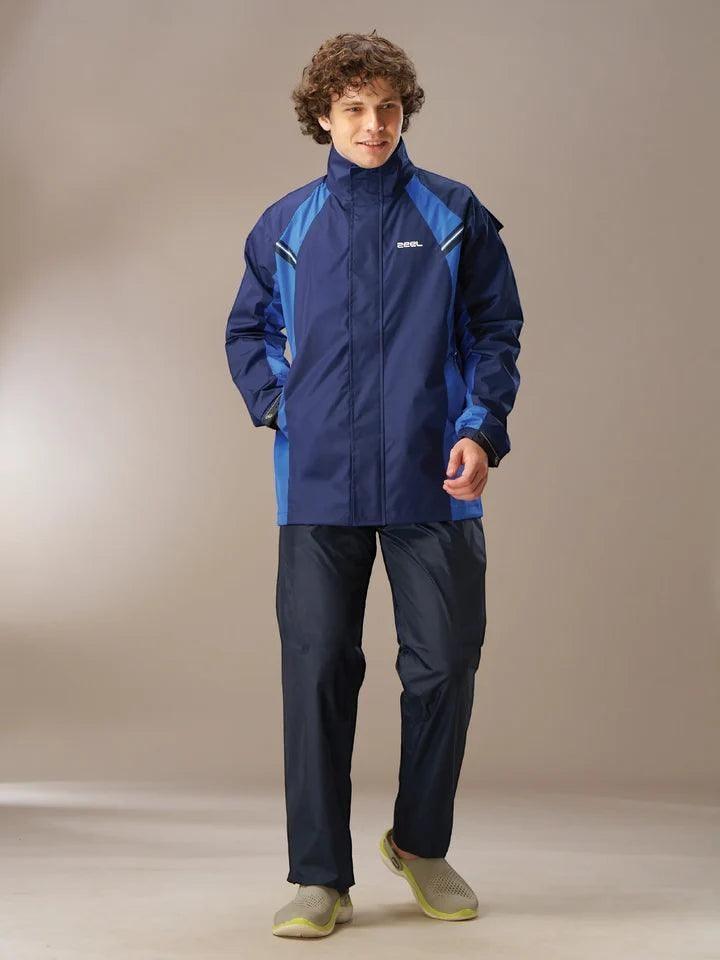City Center Zeel Go Hike black and blue waterproof rainsuit worn by a man for outdoor protection in heavy rain.