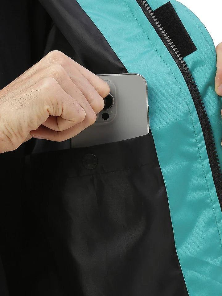 City Center Zeel Go Hike rainsuit inner utility pocket holding a smartphone, featuring waterproof fabric lining.