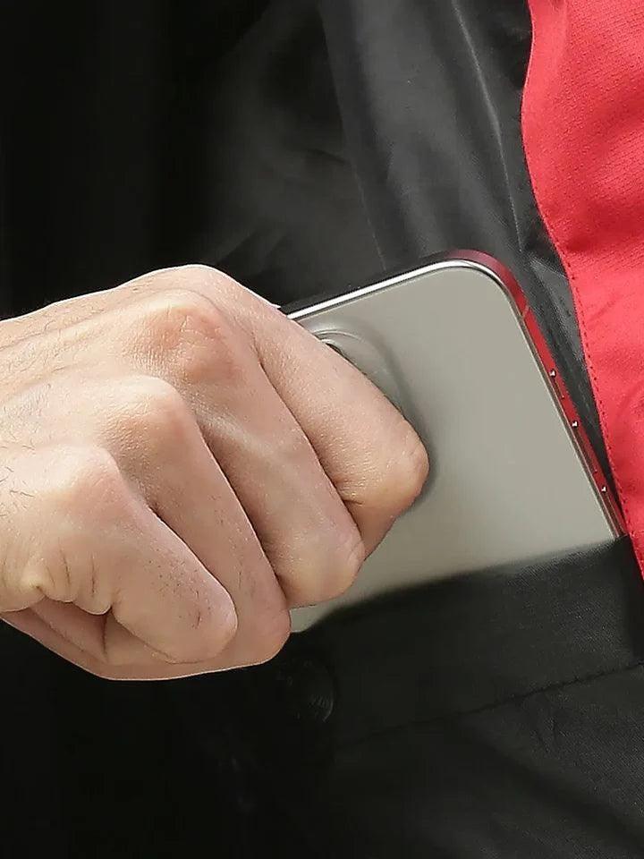 City Center Zeel Go Hike rainsuit inner utility pocket holding a smartphone with black and red fabric details