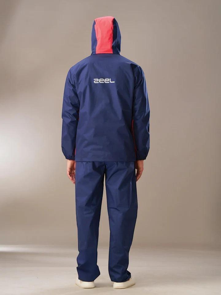 City Center Zeel Go Hike waterproof rainsuit in navy blue and red, featuring a helmet-compatible hood and taped seams.