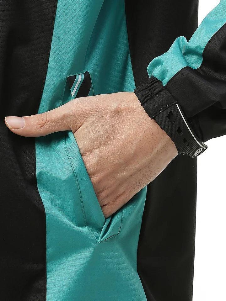 City Center Zeel Go Hike rainsuit in black and blue featuring an inverted welt pocket and silicon wrist Velcro cuff