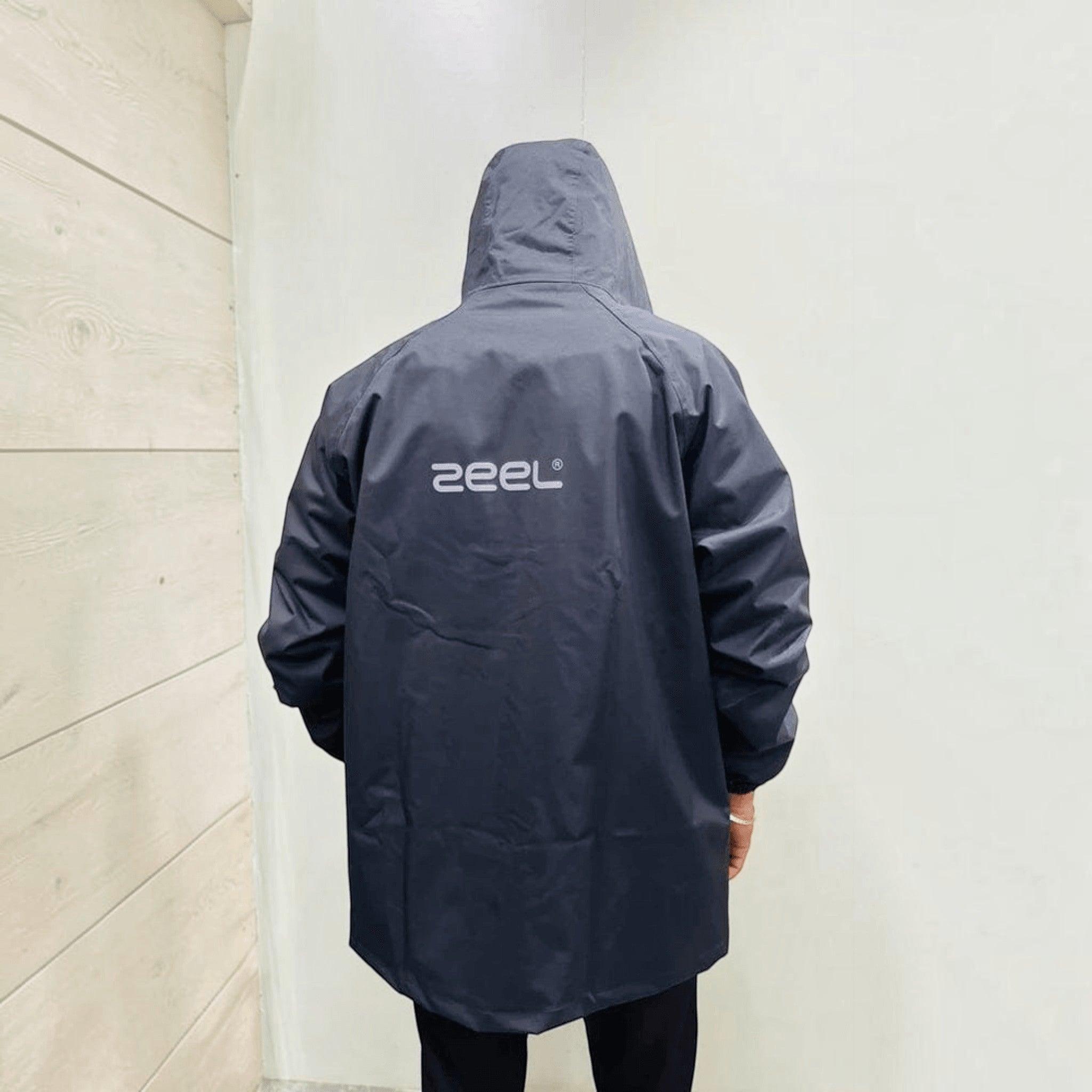 City Center Zeel ZE101 dark grey waterproof PVC-coated polyester raincoat with hood, viewed from the back.